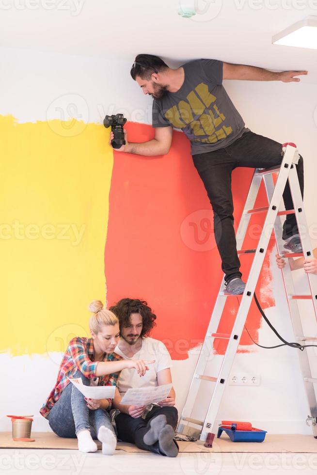 Happy young couple relaxing after painting photo