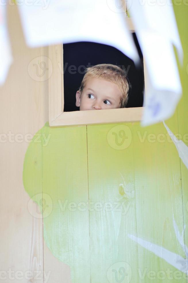 happy child in a window photo