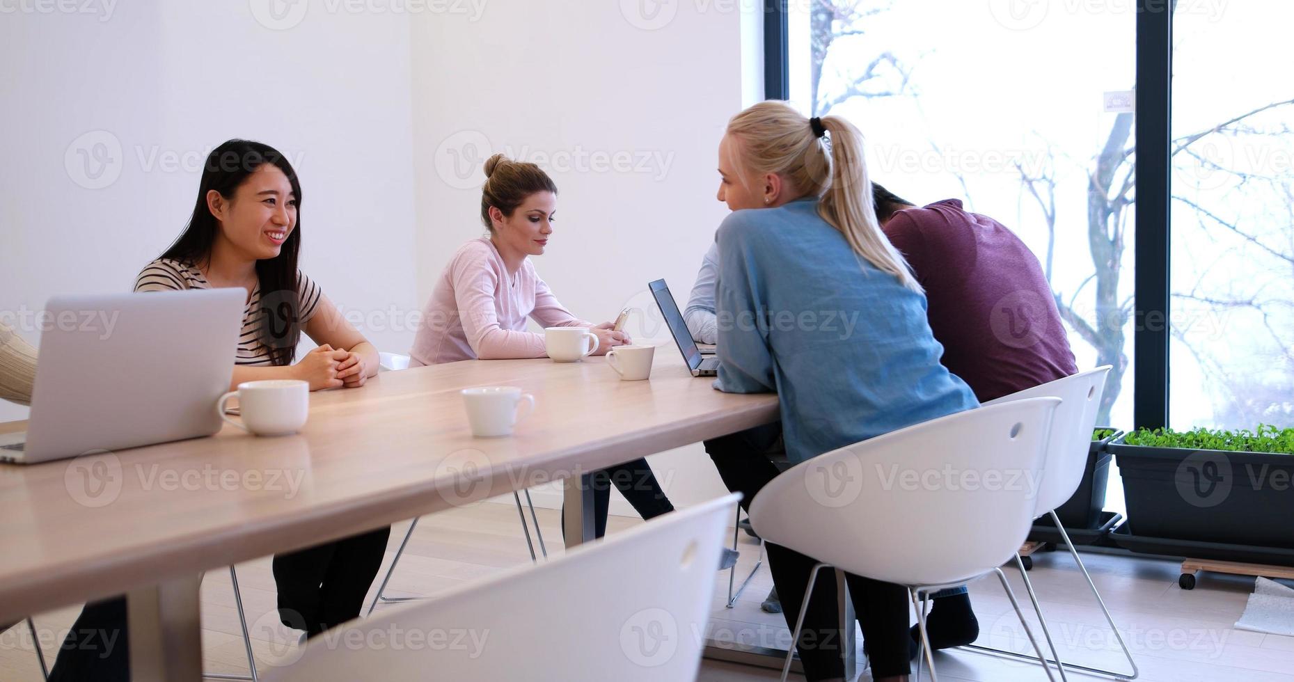 Startup Business Team At A Meeting at modern office building photo