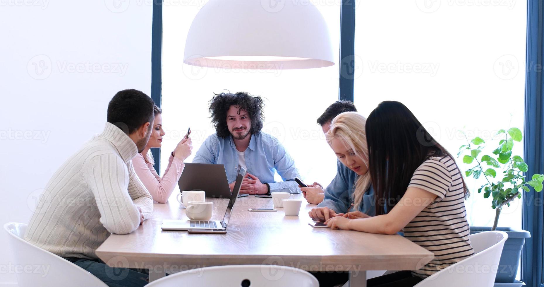 Startup Business Team At A Meeting at modern office building photo