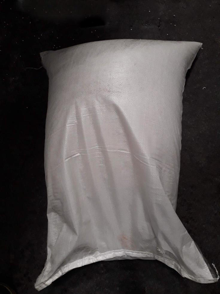 Chemical fertilizer The product stock is packed in sacks, stacked in the warehouse, waiting for delivery. photo