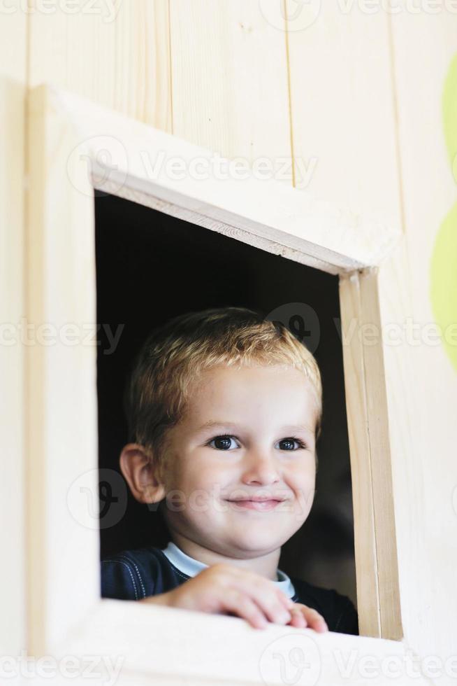 happy child in a window photo