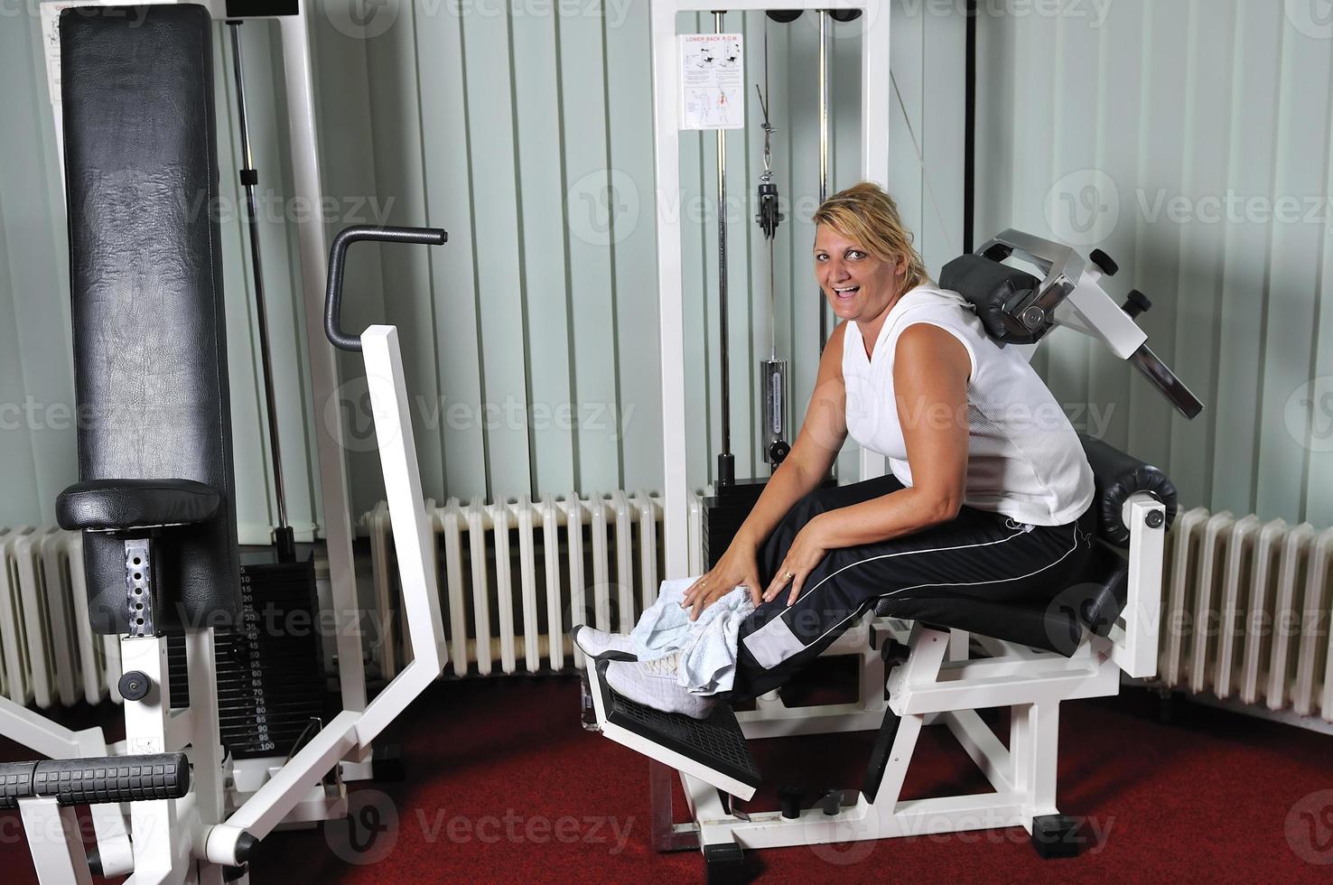 Mature  woman work out in fitness photo