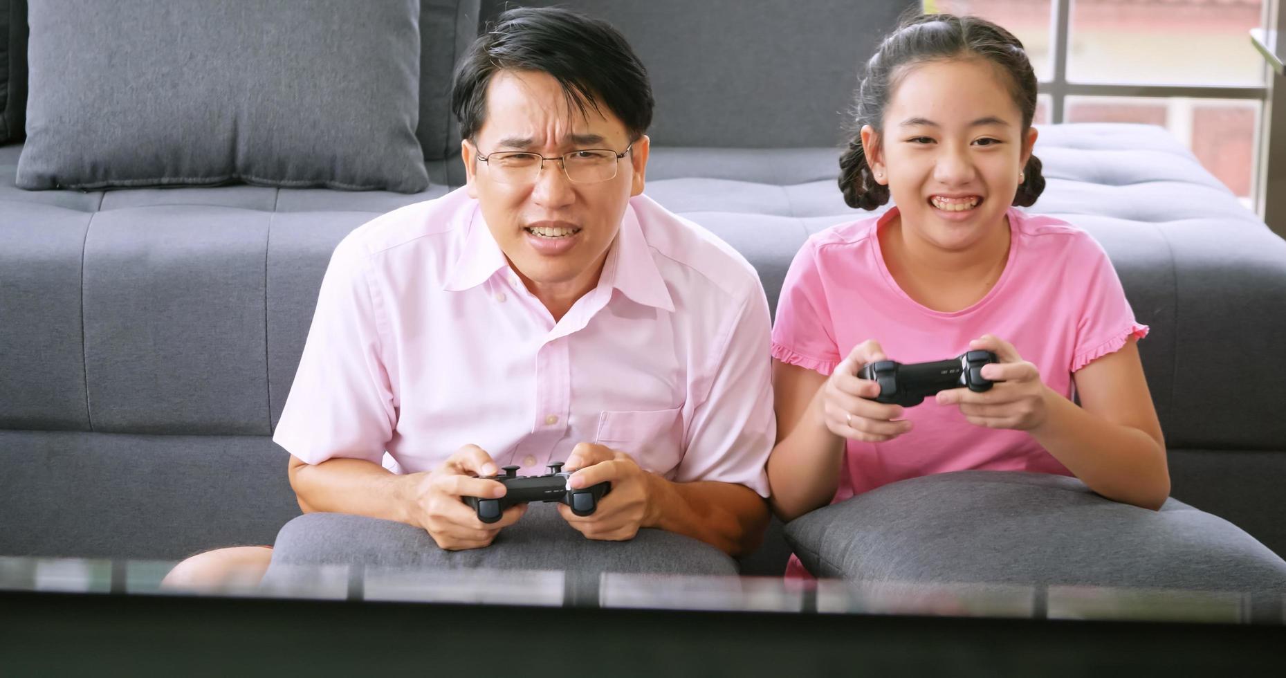 Happy family with father and daughter spending time together at home. photo