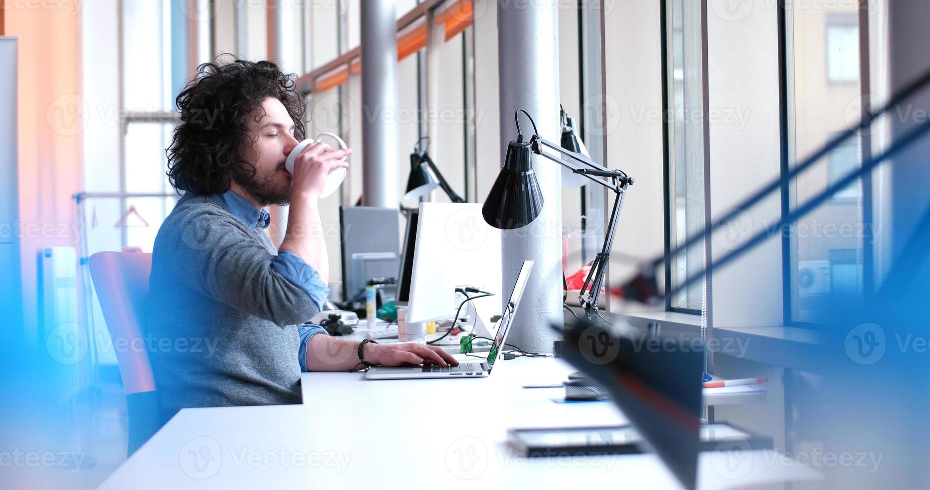businessman working using a laptop in startup office photo