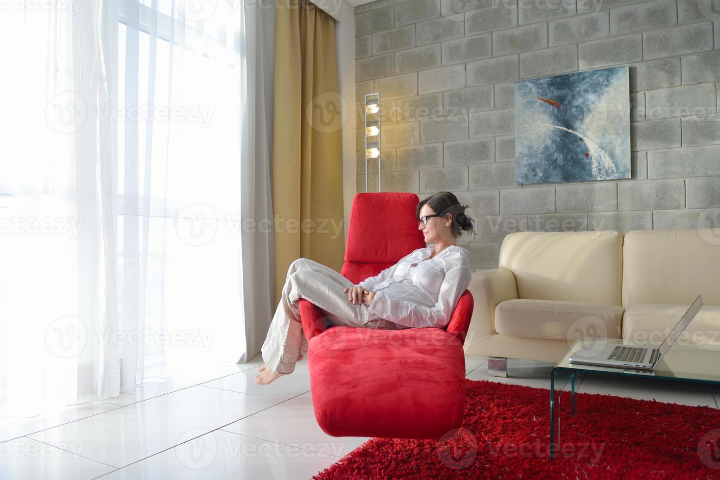 happy young woman relax at home on sofa photo