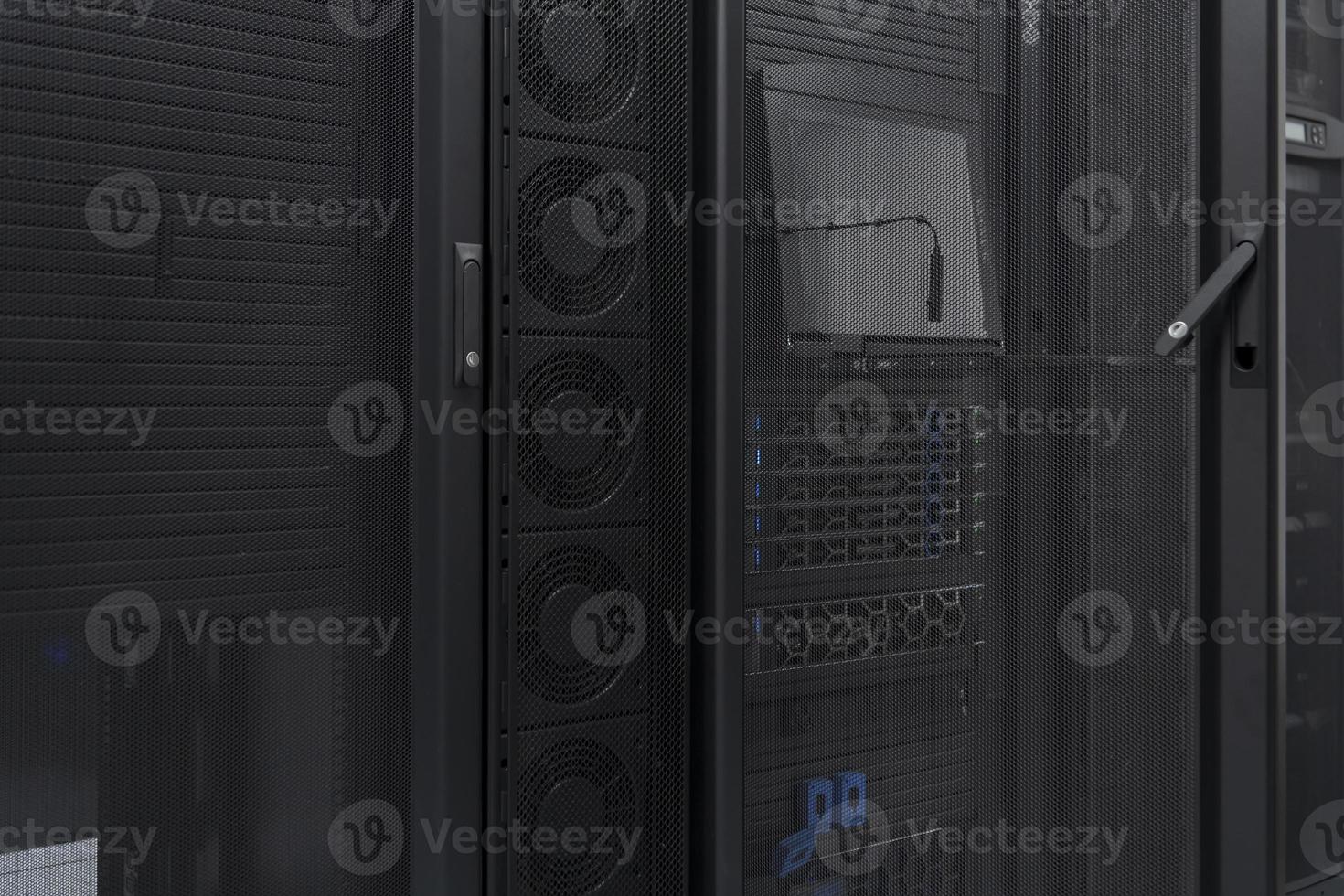 Data Center With Multiple Rows of Fully Operational Server Racks. Modern Telecommunications, Cloud Computing, Artificial Intelligence, Database, Supercomputer Technology Concept. photo
