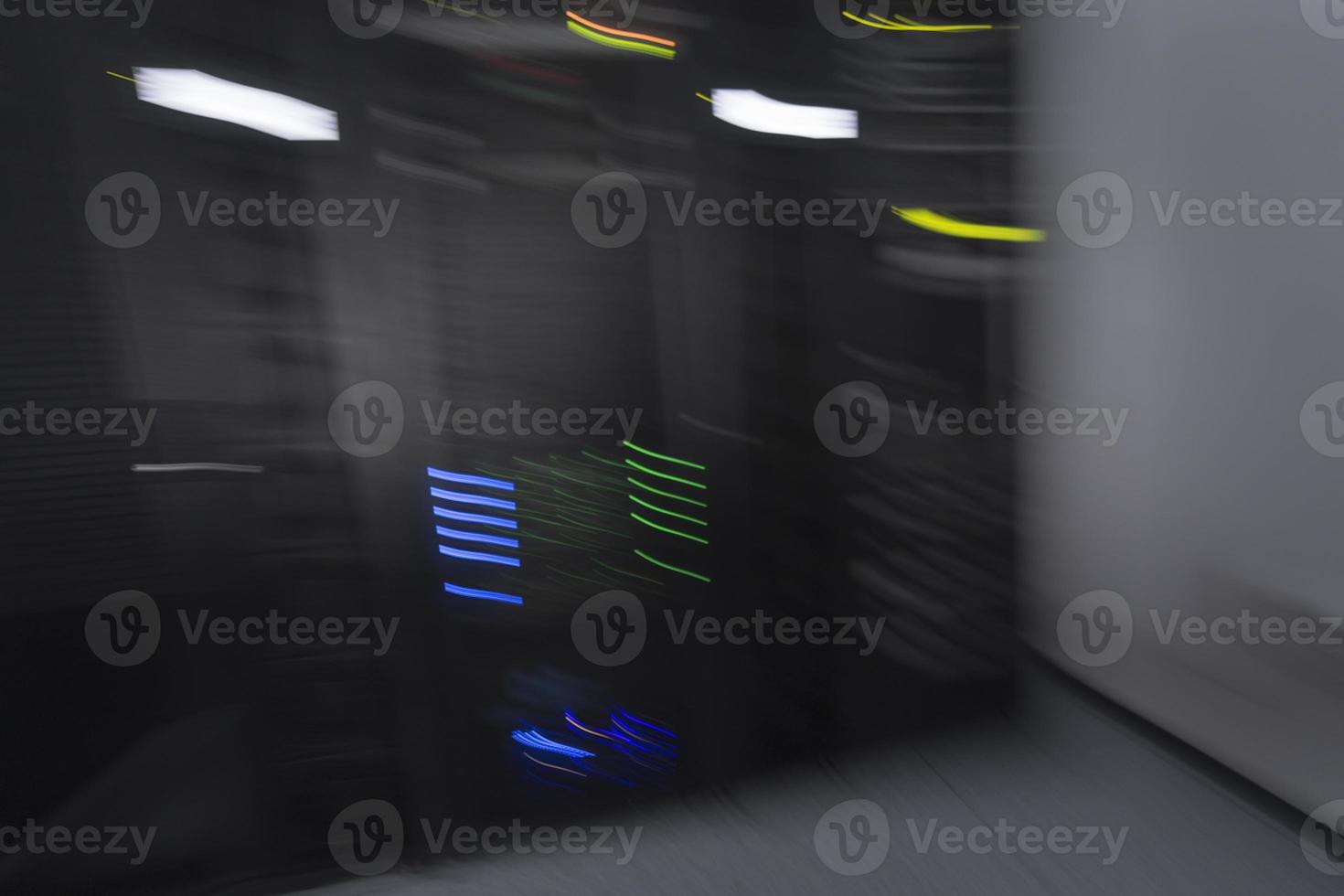 server room or data center supercomputer technology equipment, abstract close up of a server rack with motion blur. photo