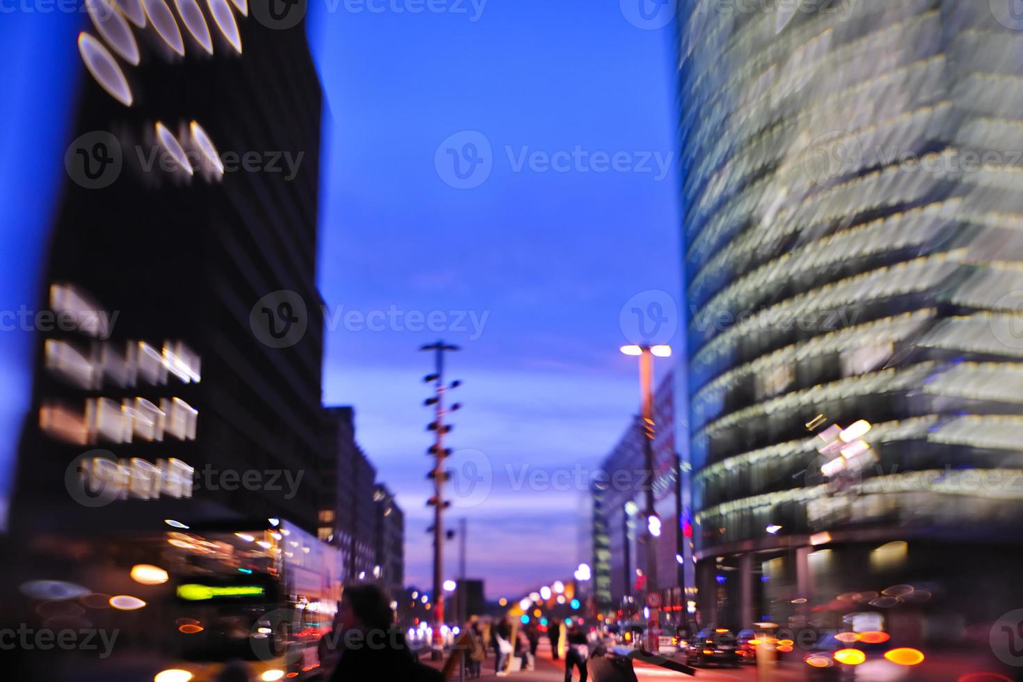 City night with cars motion blurred light in busy street photo