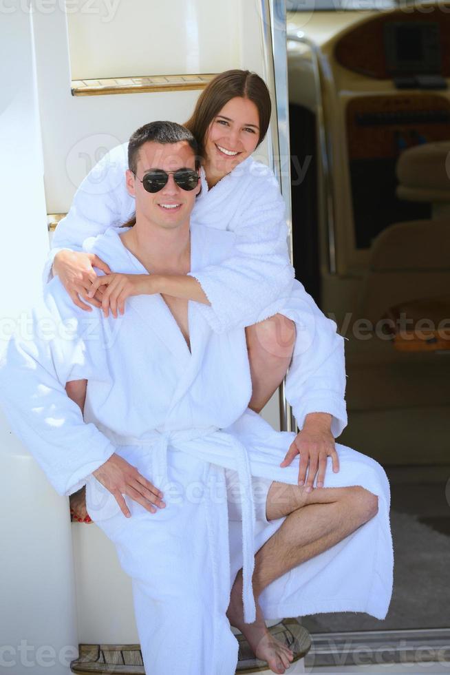 young couple on yacht photo