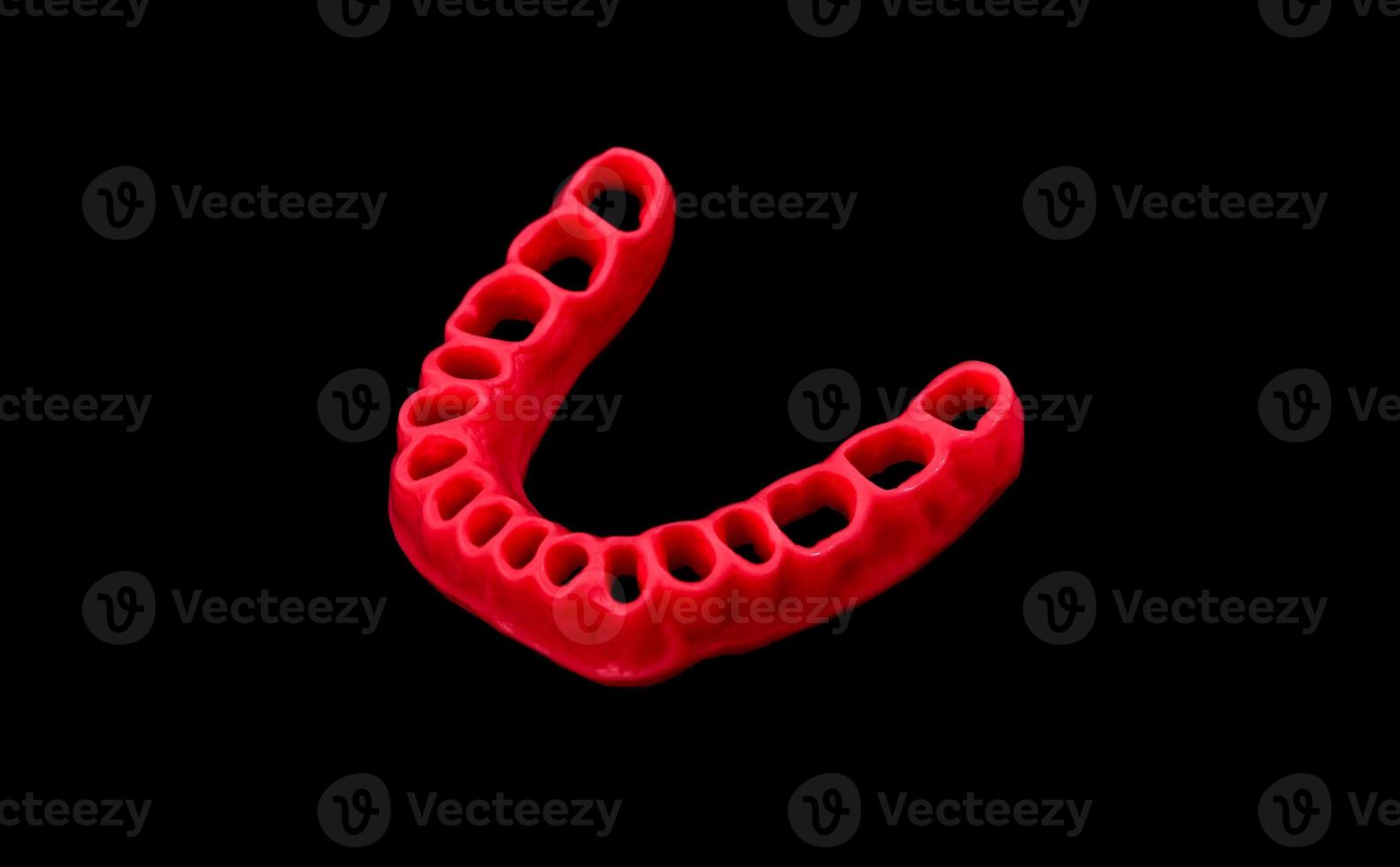 model of human gums without teeth isolated on black photo