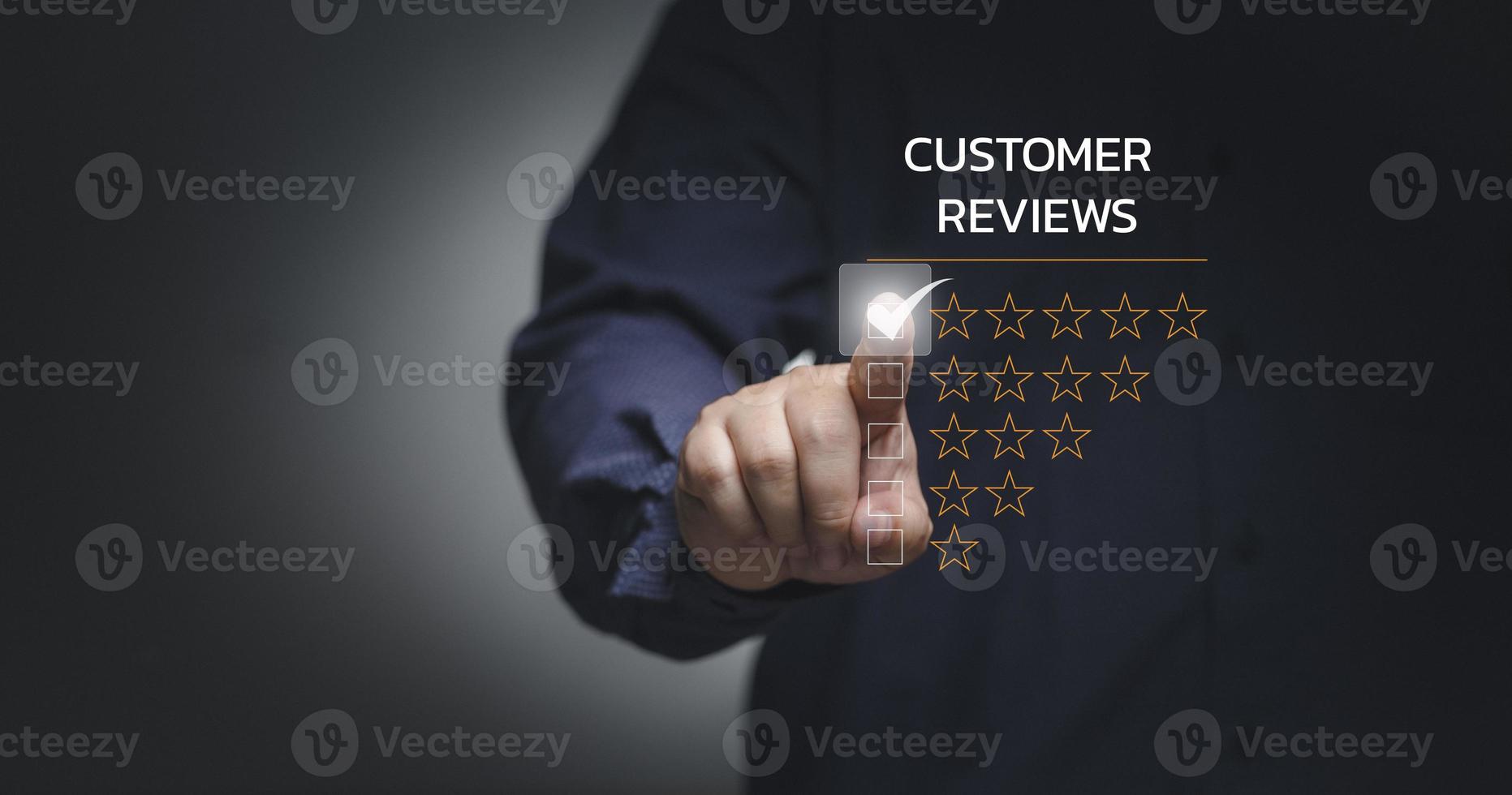 Customer service and Satisfaction concept ,Business people are touching the virtual screen on the happy Smiley face icon to give satisfaction in service. rating very impressed. photo