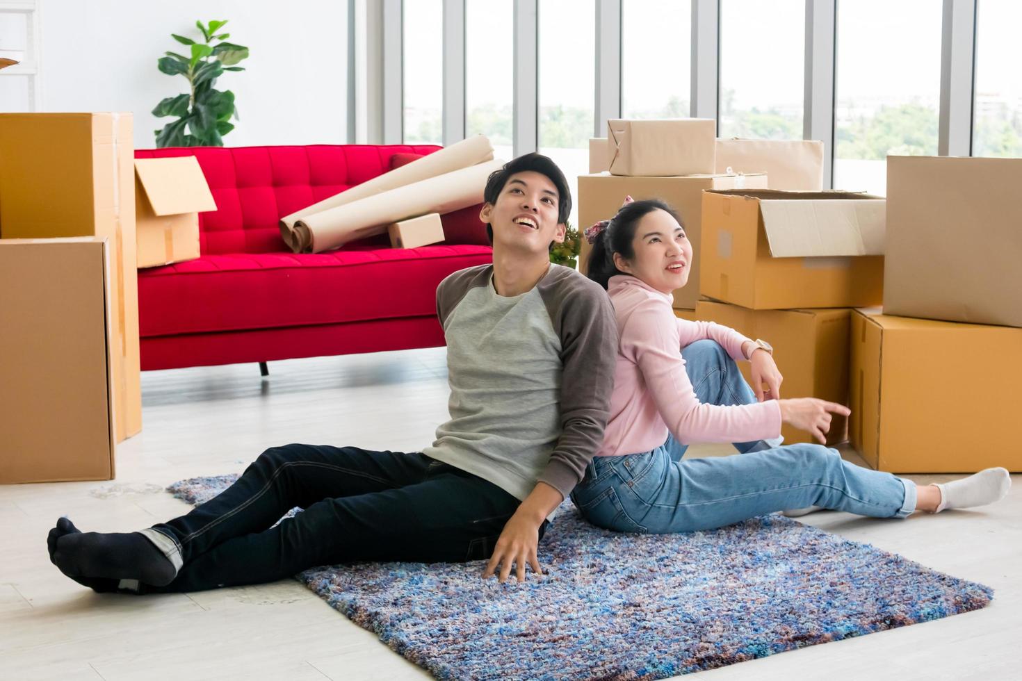 Happy young couple moving to new house together. photo