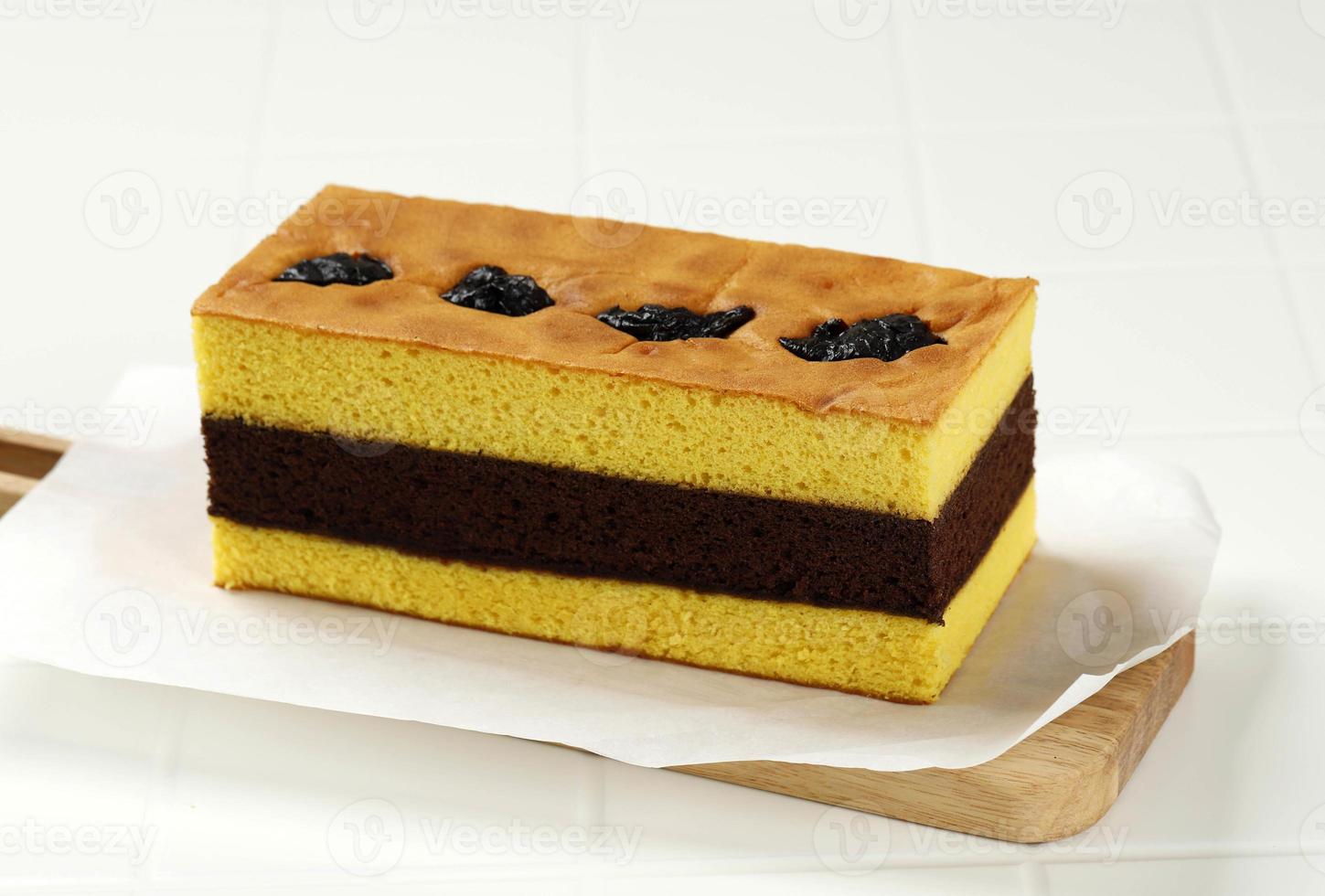 Spiku or Lapis Surabaya, Indonesian Three Layer Cake with with Strawberry Jam Between the Layer. photo