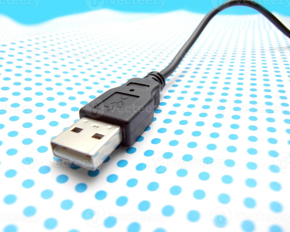 USB cable on dotted background photo