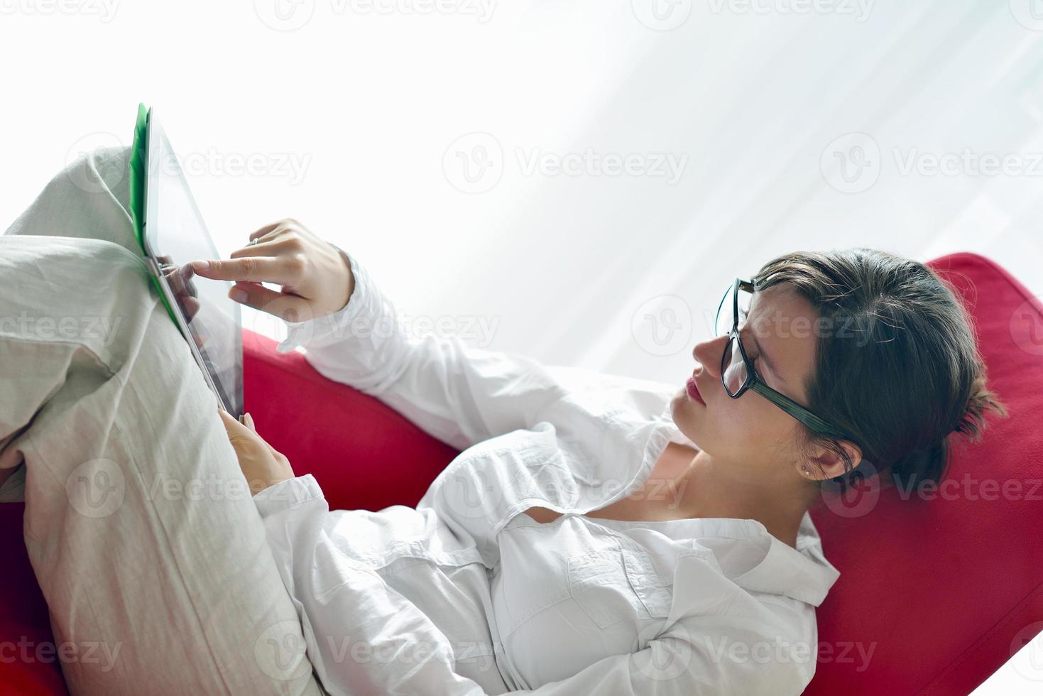 woman using tablet pc at home photo