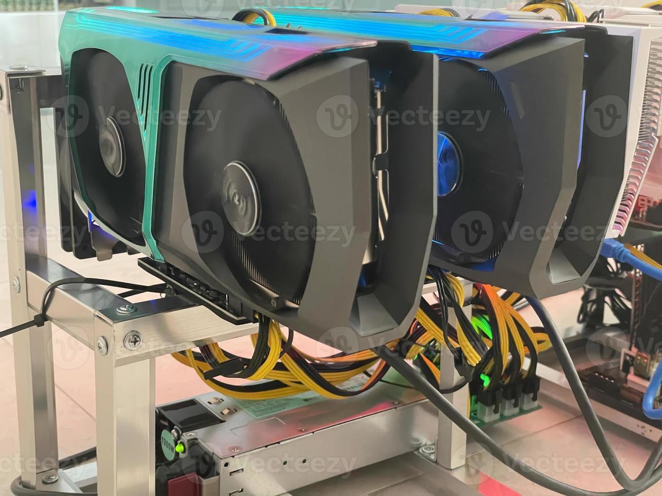 Row of bitcoin miners set up on the wired shelfs. Device for mining crypto currency. Mining cryptocurrency. Bitcoin farm. Machines for mining cryptocurrency bitcoin. Electronic device at day. photo