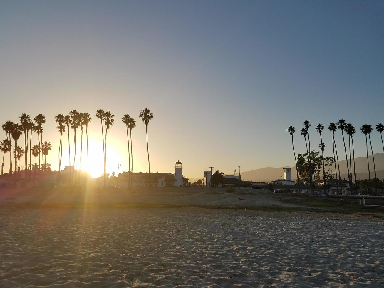 Sunsets by the lighthouse photo