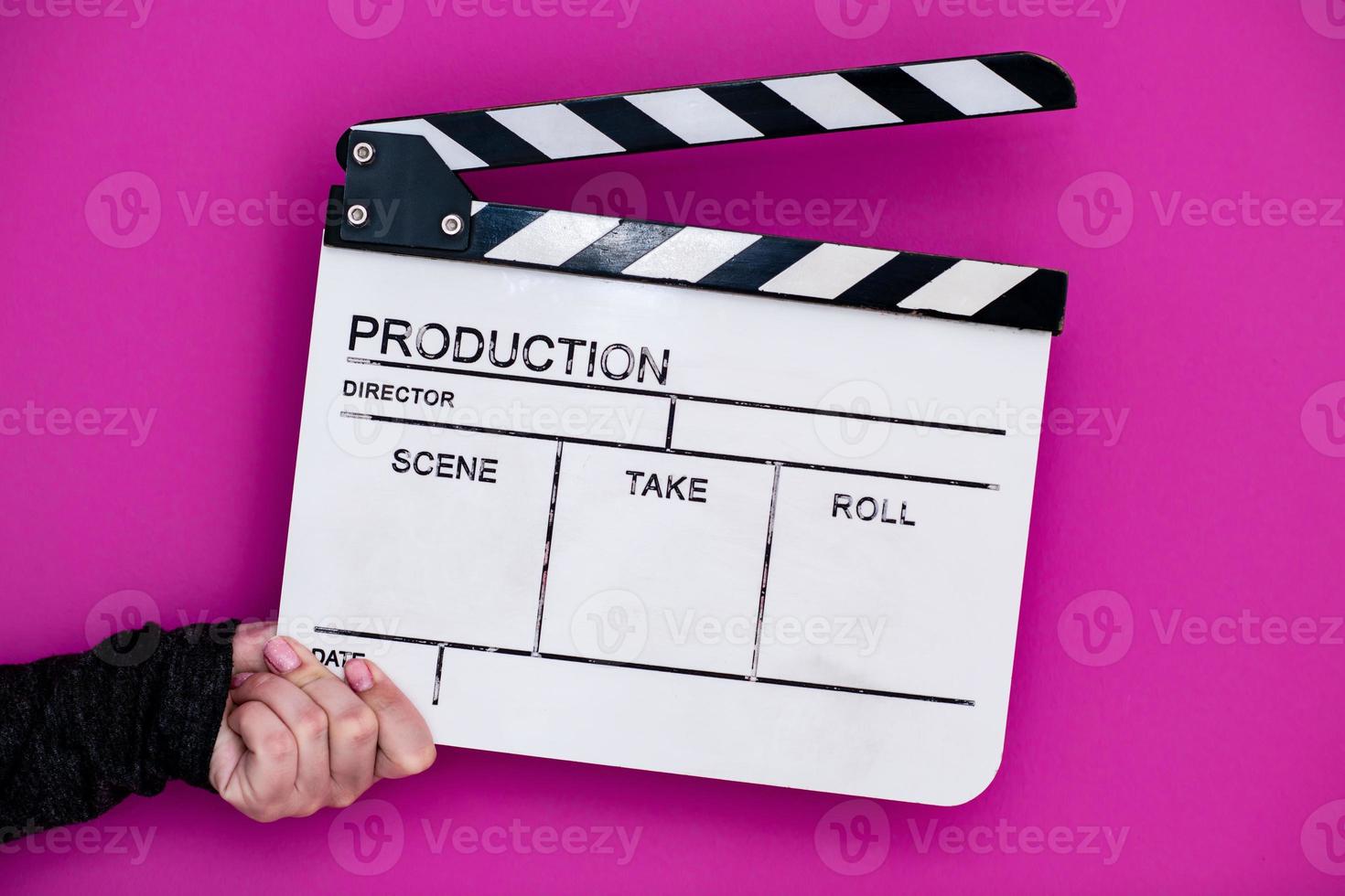 movie clapper on pink purple violet background photo