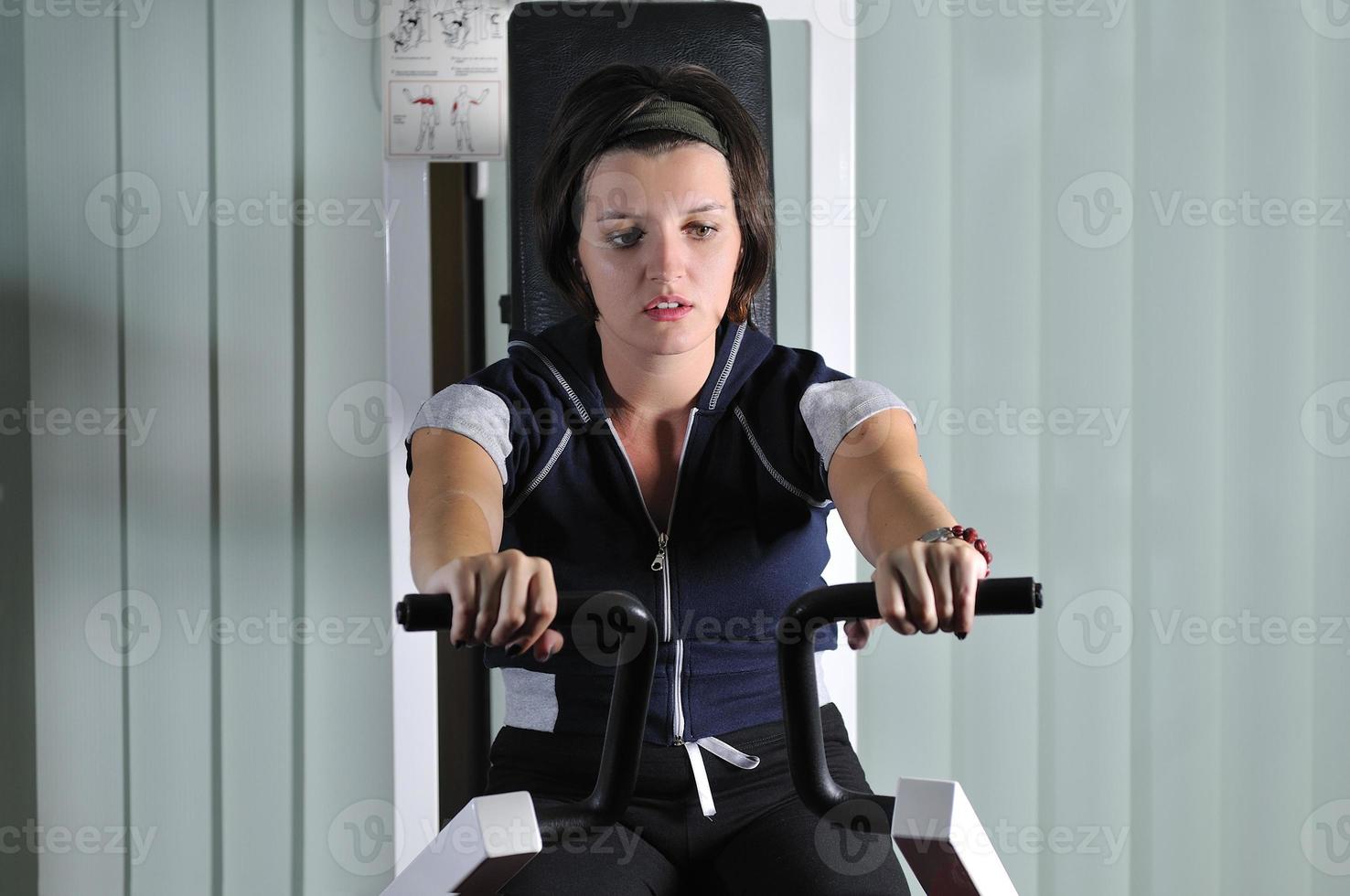 young  woman work out in fitness photo