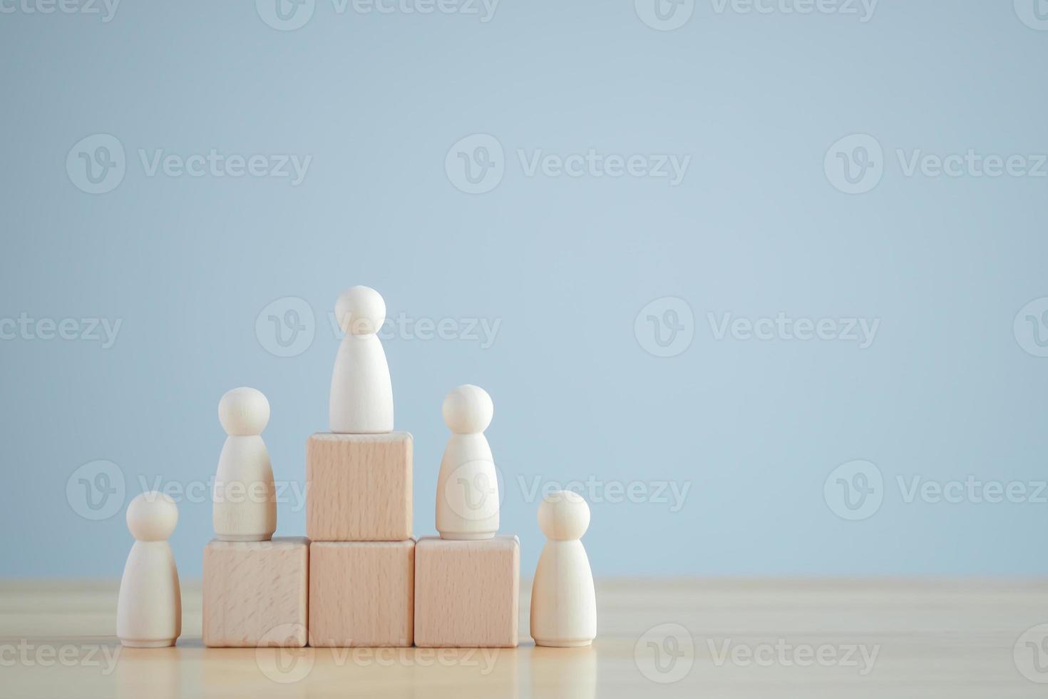 Leadership, Evaluation, Performance, Success. Wooden human standing on podium for winner business and sport competition. Human resource, Recruitment employee, Successful business team leader concept. photo