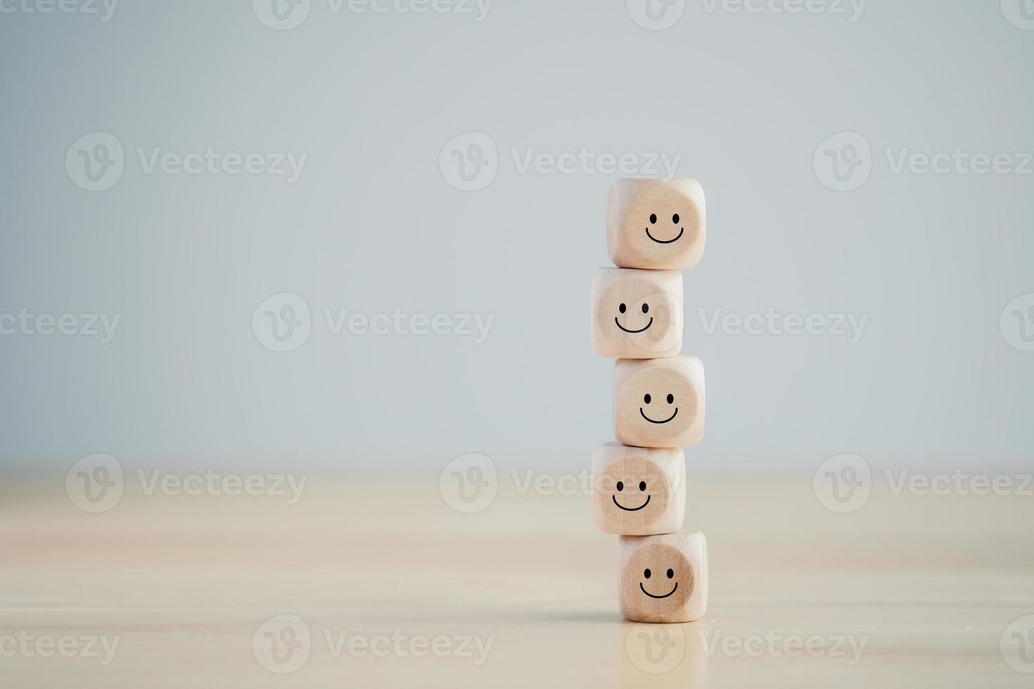 Positive emotion. Mental health assessment, World mental health day, Think positive, Customer experience feedback rating, positive service review, satisfaction survey. Wooden blocks with happy face. photo