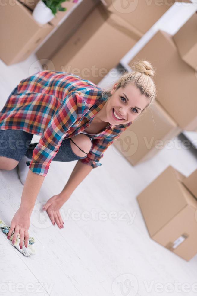 woman cleaning the floor at home photo