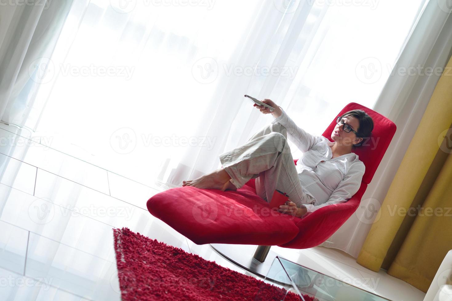 happy young woman relax at home on sofa photo