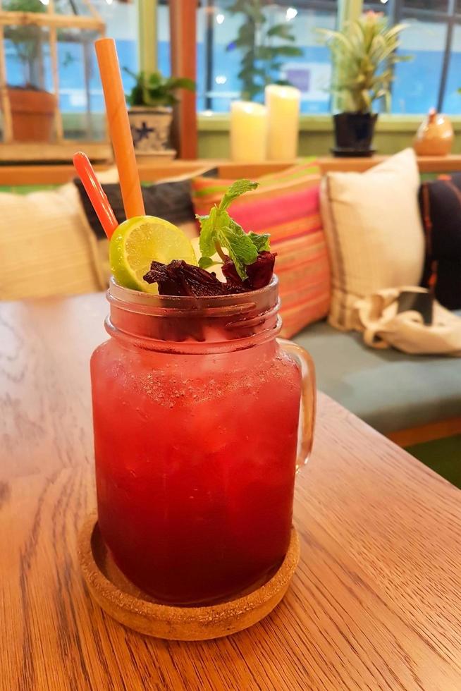 A glass of iced roselle juice mixed with lemon juice. photo