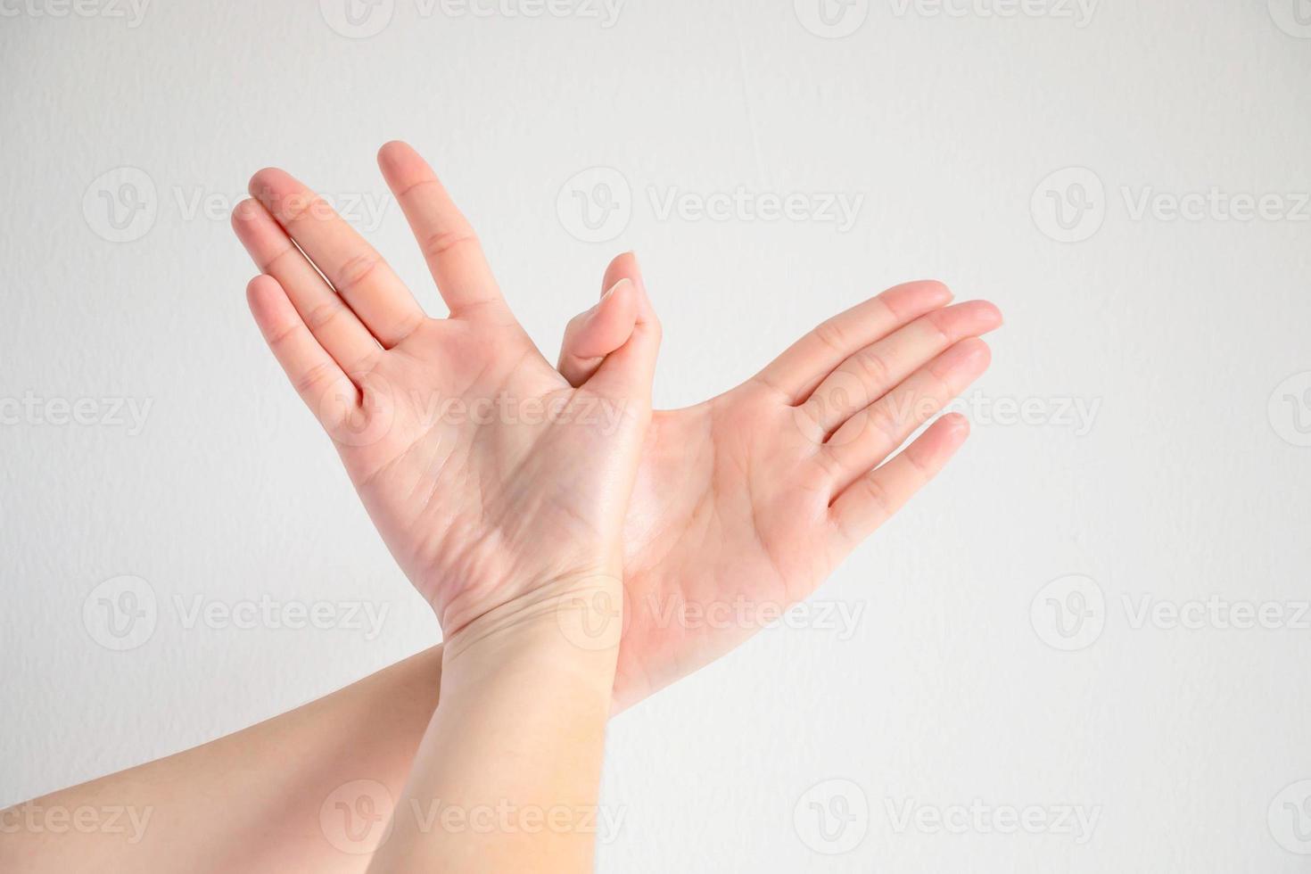Woman posturing two hands to be bird shape, symbol of freedom. photo