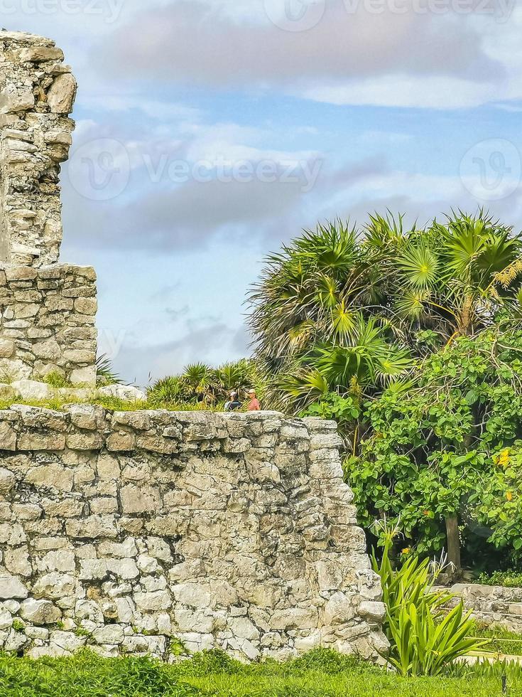 Ancient Tulum ruins Mayan site temple pyramids artifacts seascape Mexico. photo