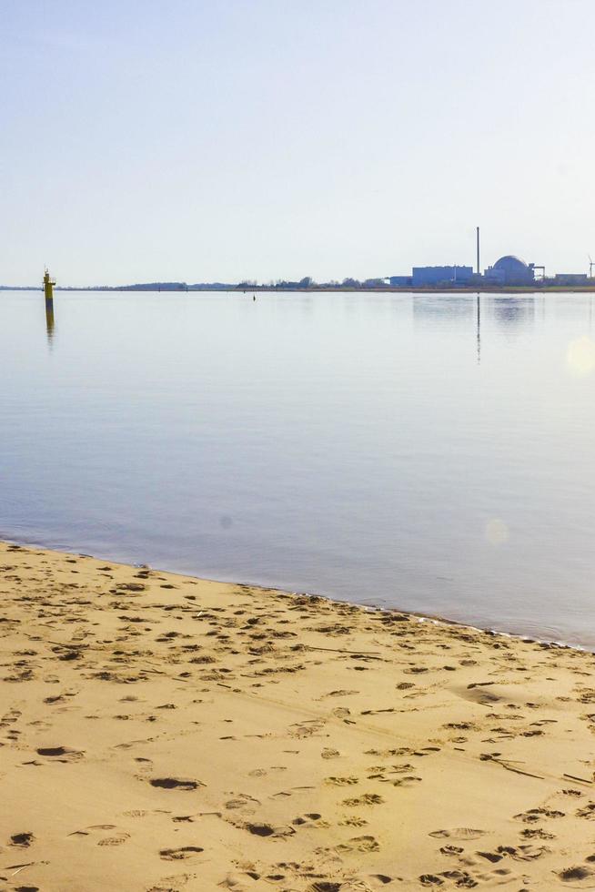 Atomic nuclear power station wadden sea tidelands coast landscape Germany. photo