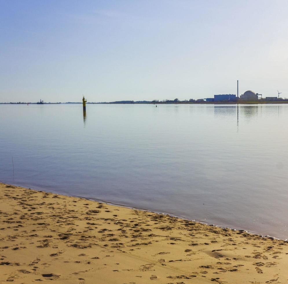 Atomic nuclear power station wadden sea tidelands coast landscape Germany. photo