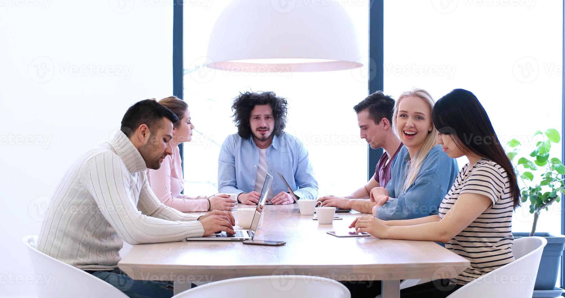 Startup Business Team At A Meeting at modern office building photo
