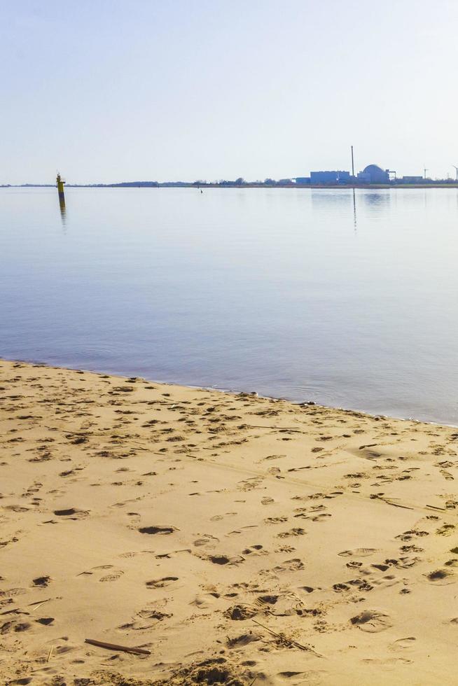 Atomic nuclear power station wadden sea tidelands coast landscape Germany. photo