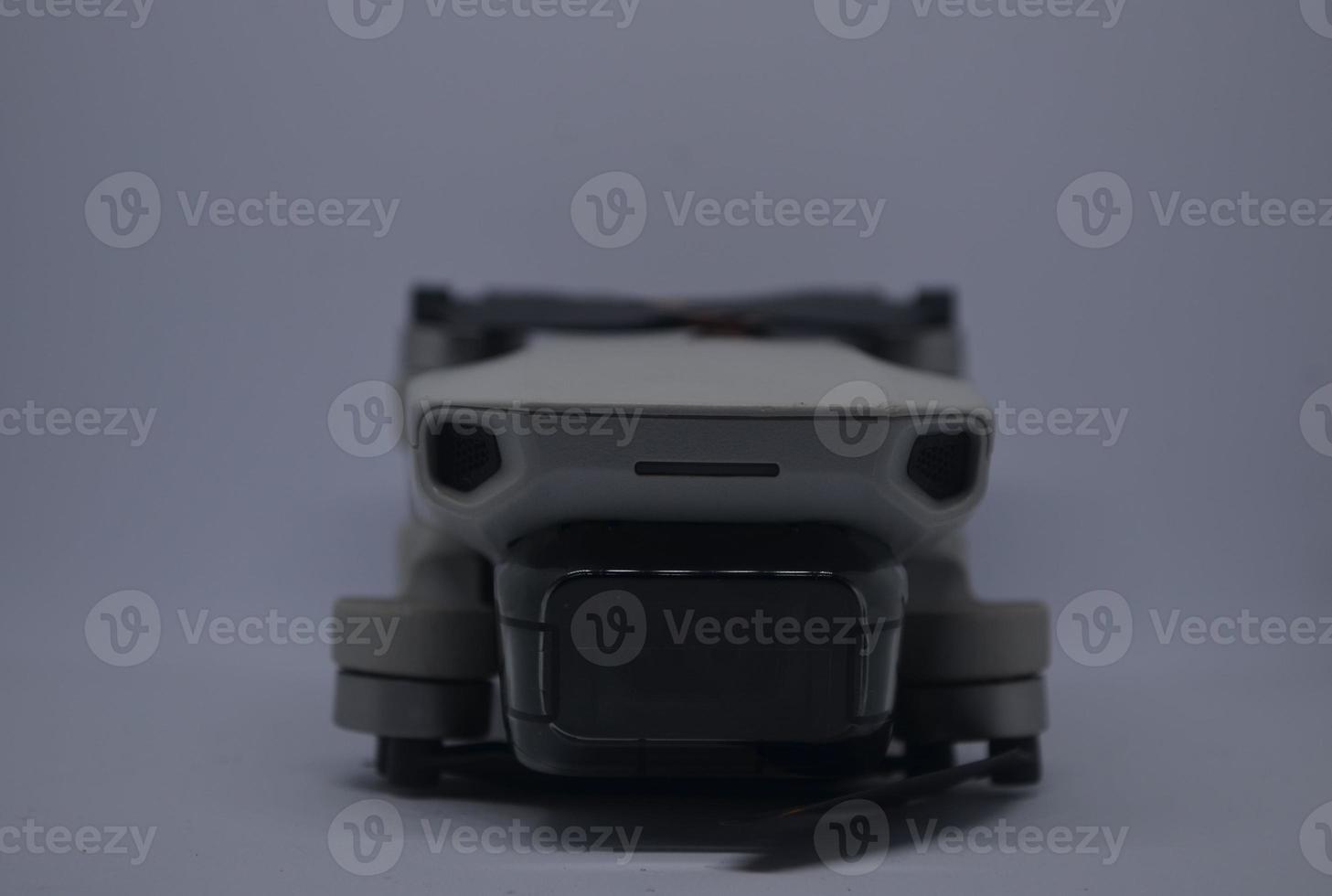 Drone quadcopter isolated with whte background. Selective focus and selective DOF photo
