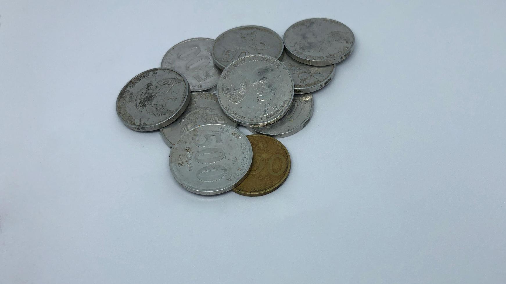 Blitar, Indonesia, August 20th 2022 The Indonesian state currency is in the form of slightly worn metal pieces photo