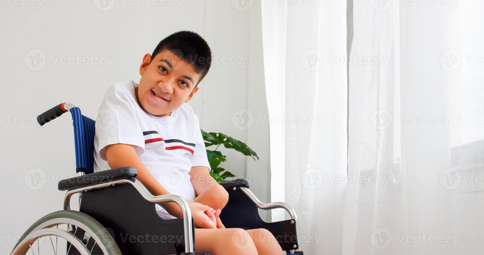 Disabled boy in a wheelchair. photo