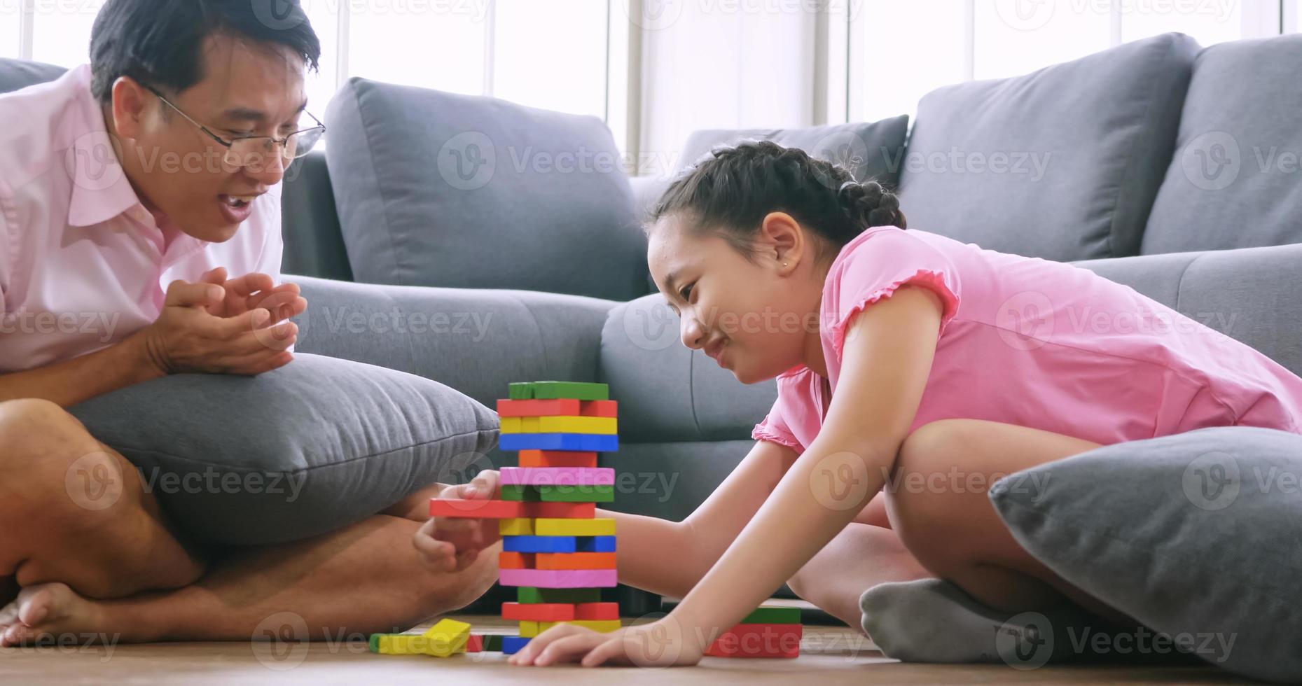Happy family with father and daughter spending time together at home. photo