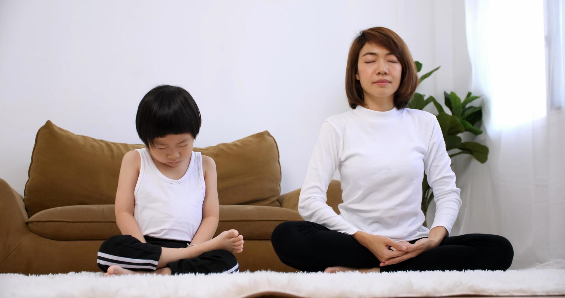 Young mother with her little son spending time together at home. photo