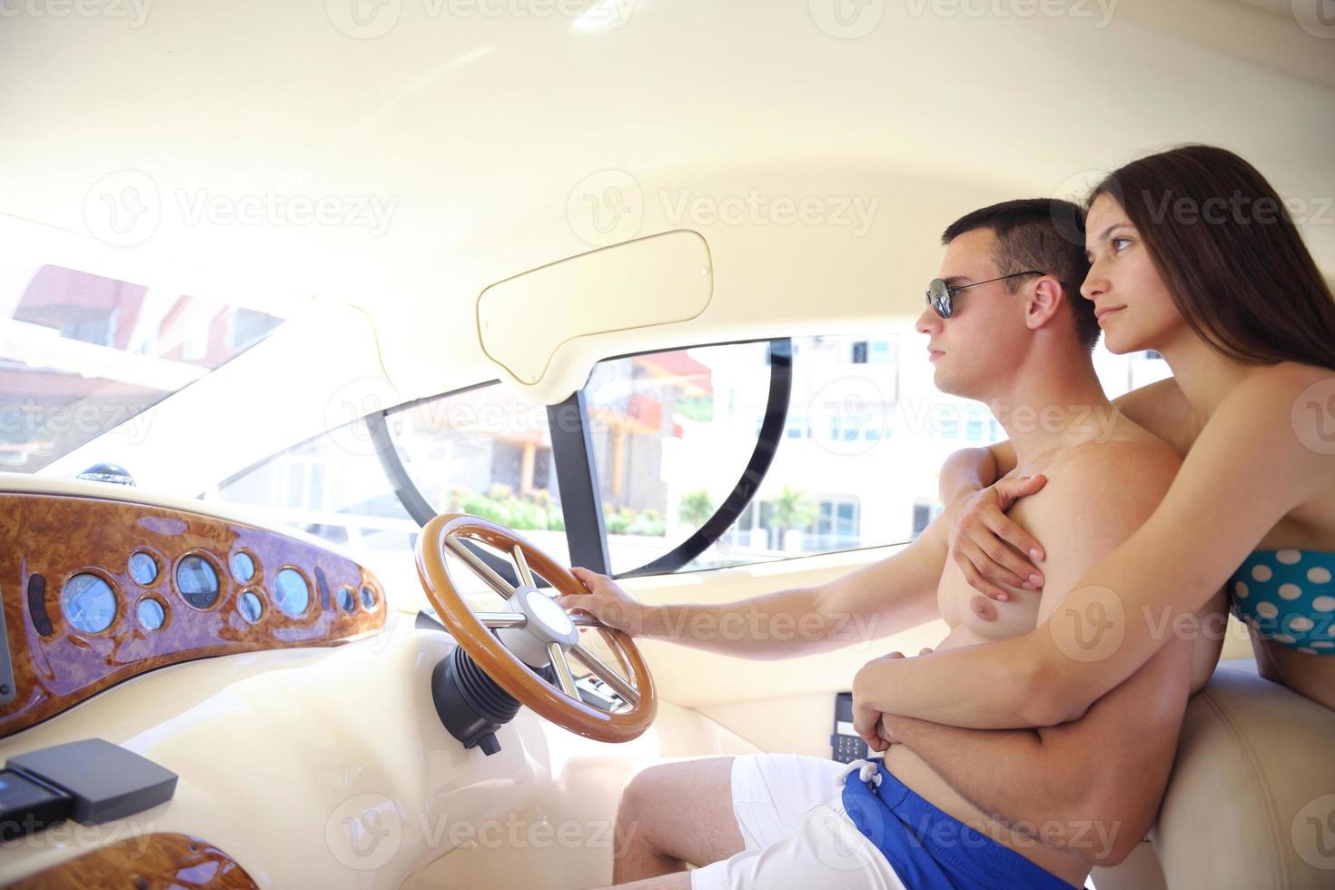 young couple on yacht photo