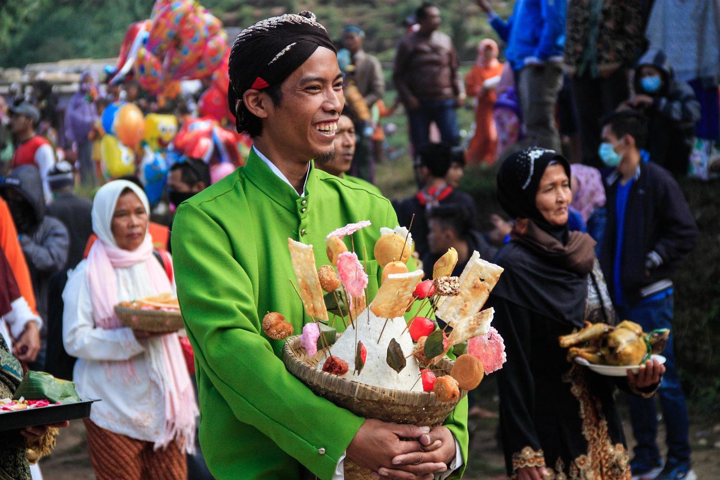 Dieng, Indonesia - August 1, 2015. Dieng Culture Festival, Tourists follow the dreadlocks procession during the Dieng Culture Festival event at Dieng, Banjarnegara district, Central Java photo