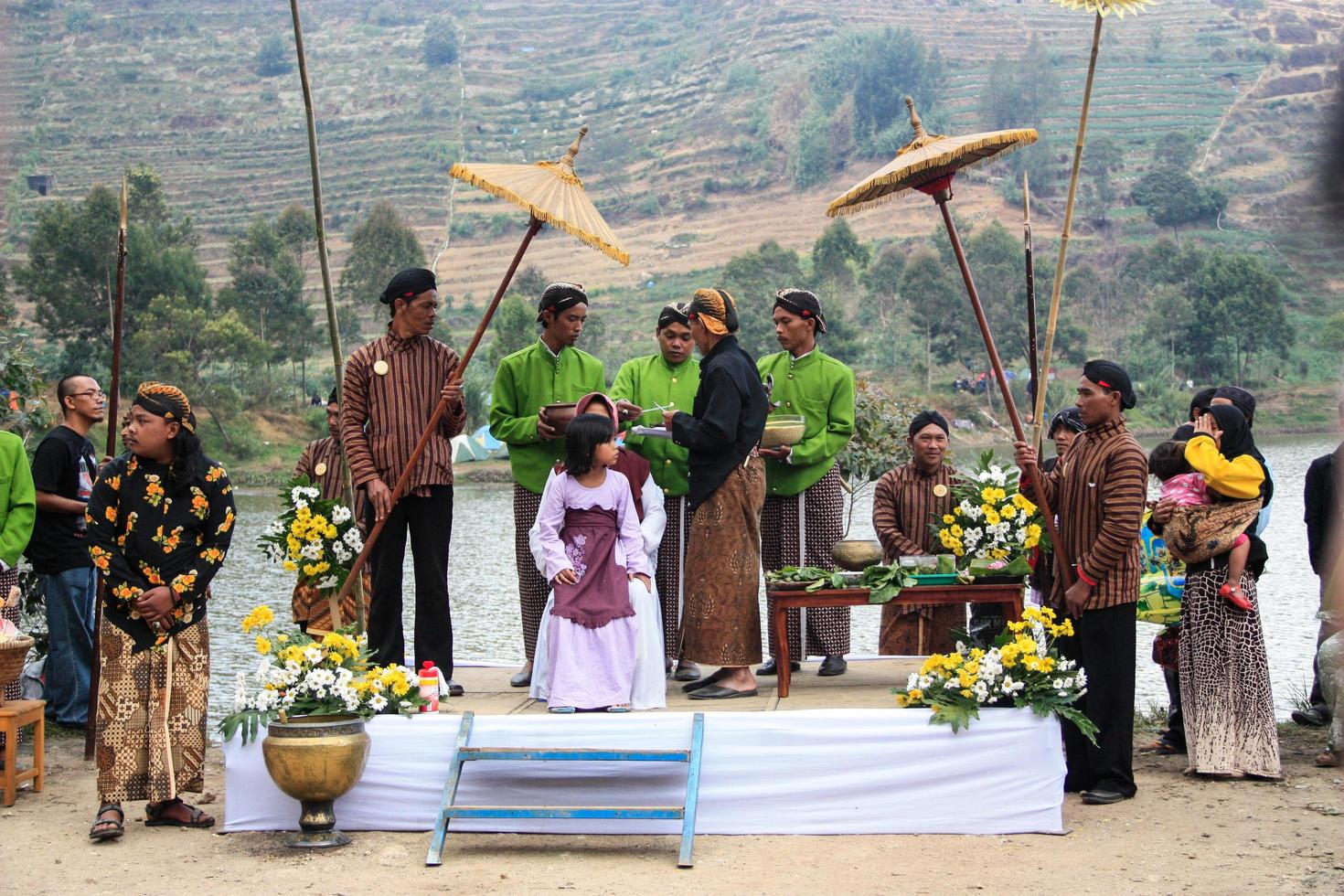 Dieng, Indonesia - August 1, 2015. Dieng Culture Festival, Tourists follow the dreadlocks procession during the Dieng Culture Festival event at Dieng, Banjarnegara district, Central Java photo