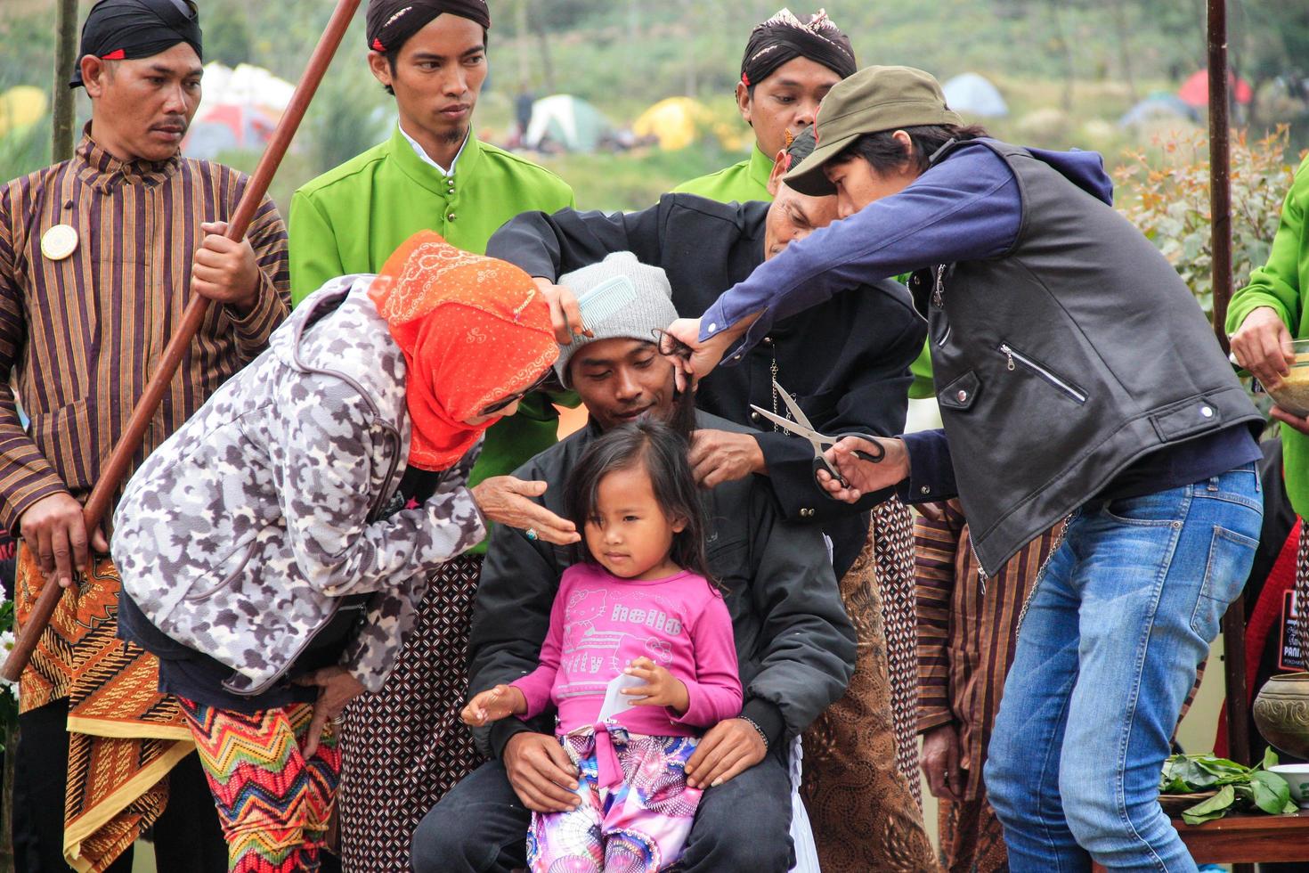 Dieng, Indonesia - August 1, 2015. Dieng Culture Festival, Tourists follow the dreadlocks procession during the Dieng Culture Festival event at Dieng, Banjarnegara district, Central Java photo