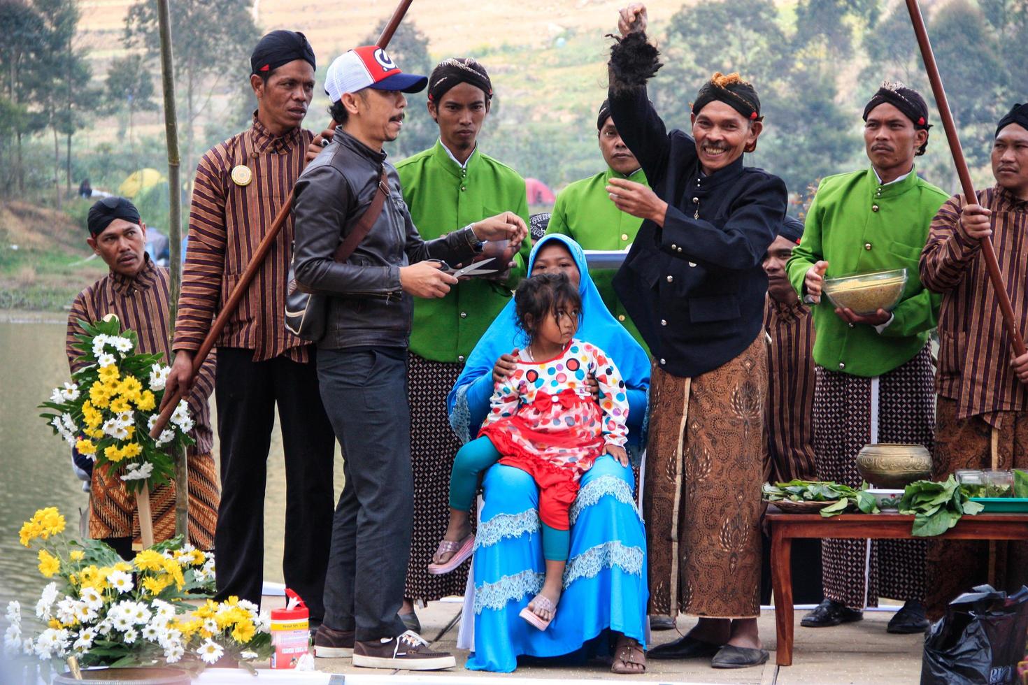 Dieng, Indonesia - August 1, 2015. Dieng Culture Festival, Tourists follow the dreadlocks procession during the Dieng Culture Festival event at Dieng, Banjarnegara district, Central Java photo