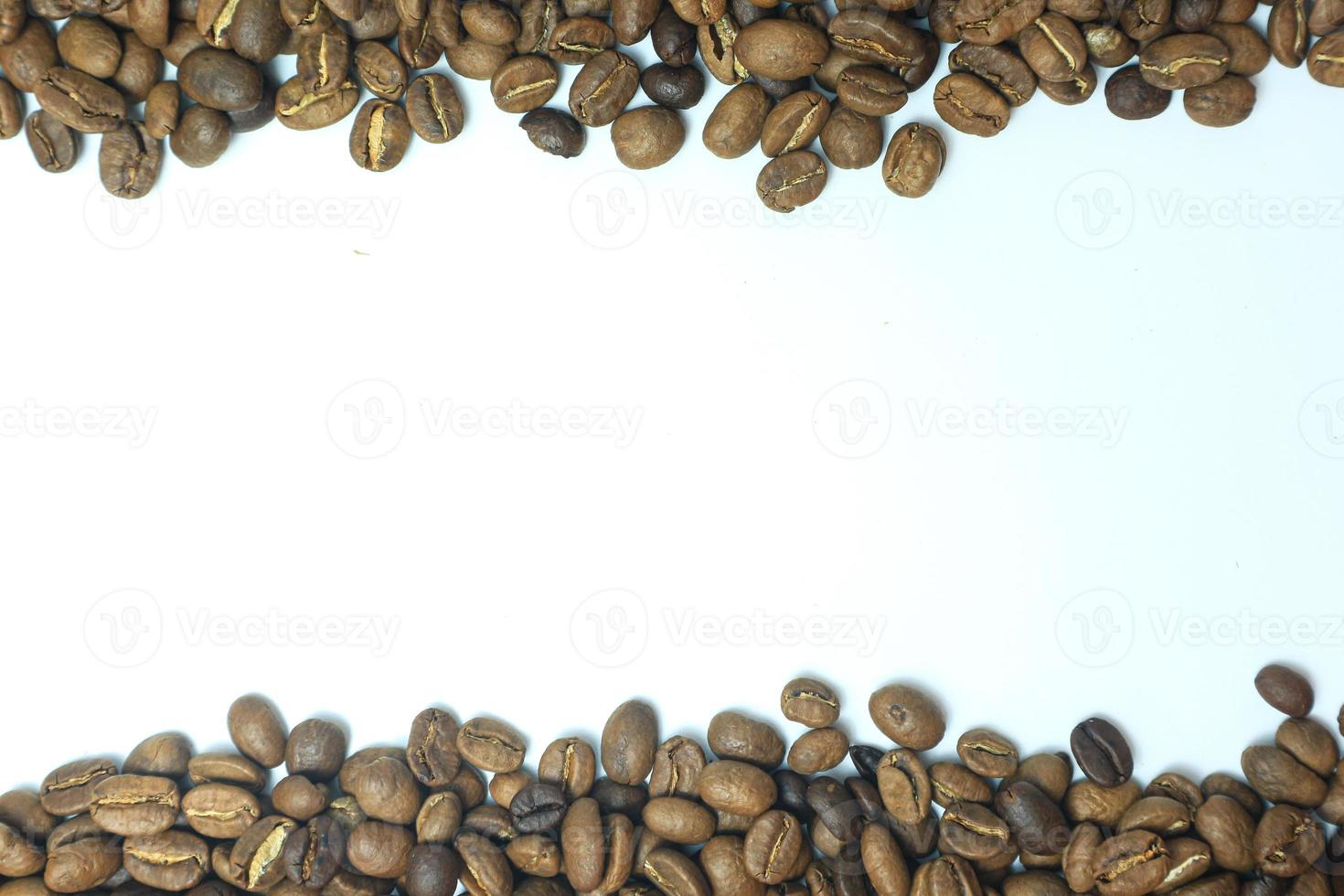 Frame of roasted coffee beans isolated on white may use as background or texture photo
