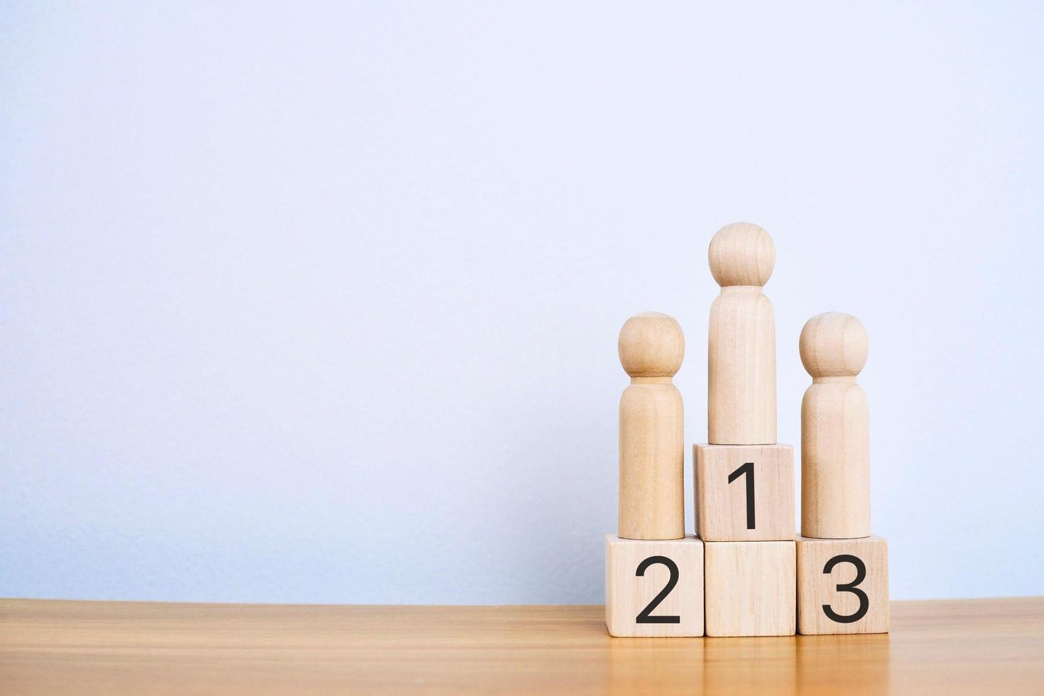 Wooden blocks stacked as a platform on a white background. Success or ranking ideas photo