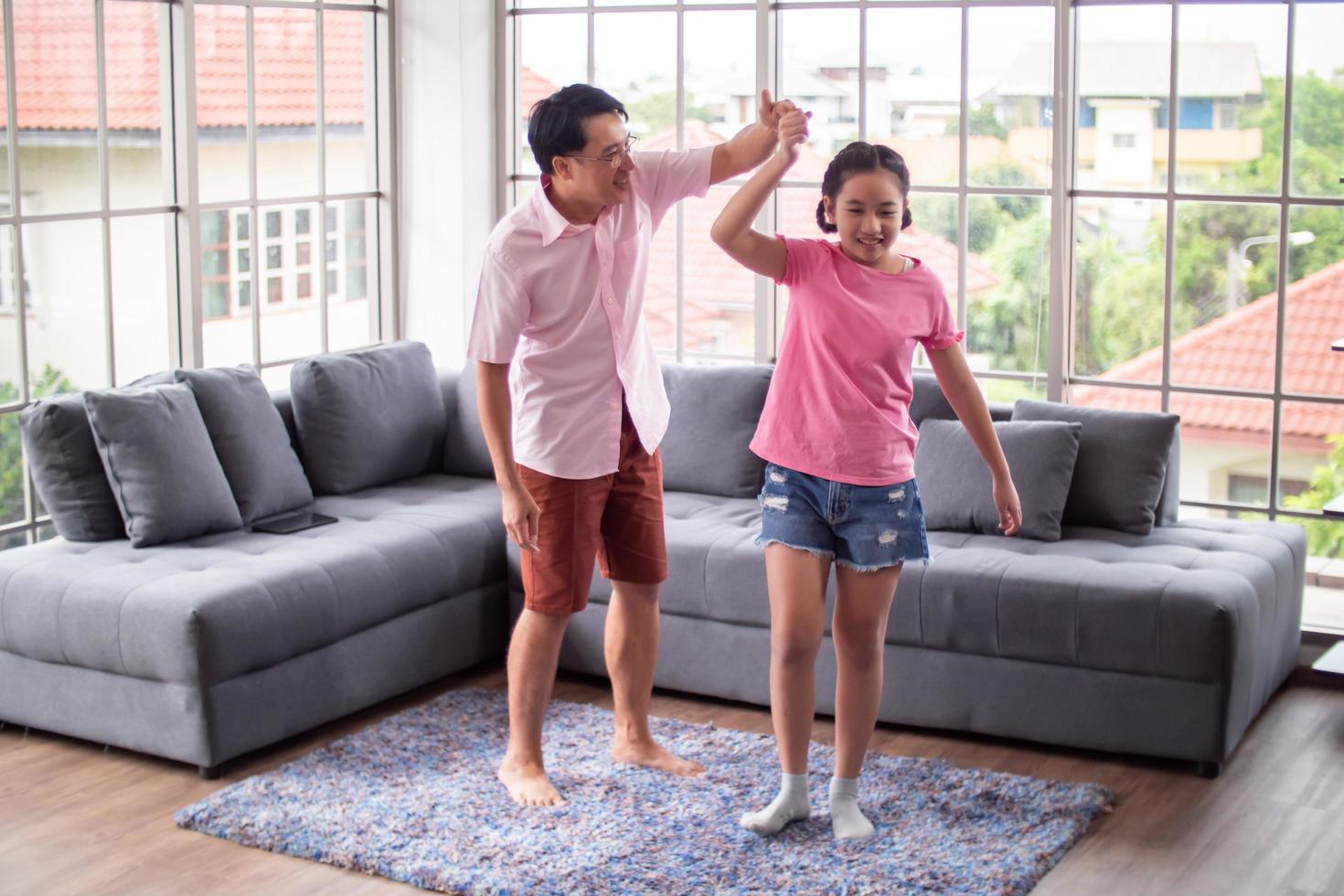 Happy family with father and daughter spending time together at home. photo