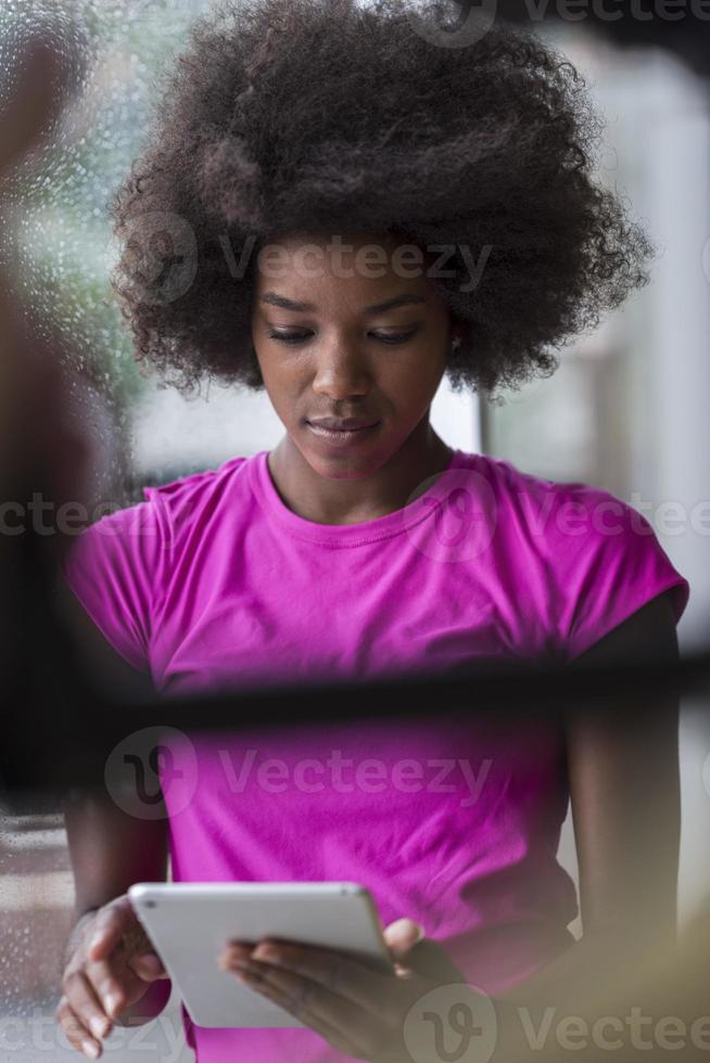 african american woman using tablet photo