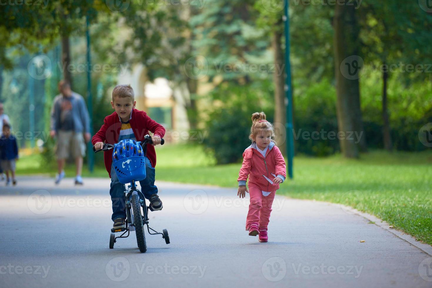 boy and girl with bicycle photo